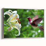 Framed silver wall art showcasing a vibrant hummingbird design on canvas, elegantly displayed from a side view, perfect for enhancing home decor.