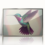 Framed wall art featuring a vibrant hummingbird design in shades of green and blue, displayed in a sleek acrylic frame with a silver finish, perfect for nature lovers.