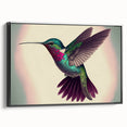 Framed wall art featuring a vibrant hummingbird design on canvas, showcasing intricate details in bright colors against a black background, perfect for nature-themed decor.