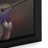 Close-up of a framed canvas art piece featuring vibrant hummingbird designs, showcasing intricate details and rich colors, perfect for nature enthusiasts and home decor.