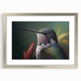 Framed wall art featuring a vibrant hummingbird design, elegantly presented in a silver frame with a mat, perfect for enhancing home decor with a touch of nature.