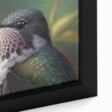 Close-up of a framed canvas wall art featuring a vibrant hummingbird design, showcasing intricate details and vivid colors, perfect for adding a touch of nature to home decor.
