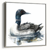 Framed canvas wall art featuring a serene loon design, showcasing intricate details in silver tones, displayed from a side view against a neutral background. Ideal for nature lovers and modern decor enthusiasts.
