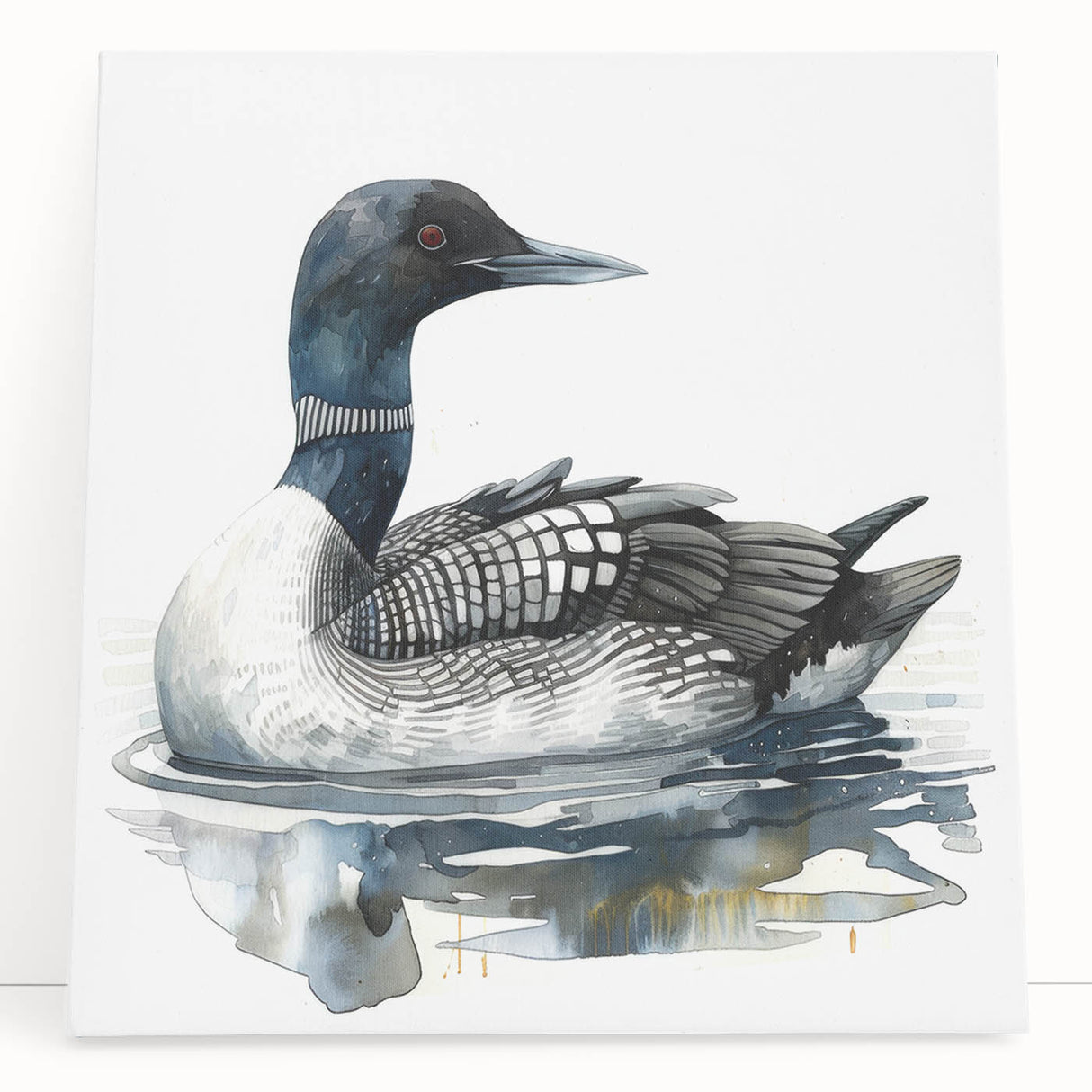 Stretched canvas artwork showcasing a serene loon design, featuring soft blue and gray colors, elegantly leaning against a wall, perfect for nature-inspired decor.