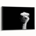 Framed wall art featuring a detailed ostrich design on a black background, showcasing vibrant colors and intricate patterns, ideal for modern home decor.