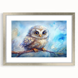 Framed wall art showcasing an intricate owl design in silver frame with matting, perfect for enhancing home decor with a touch of nature-inspired elegance.