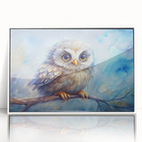 Framed wall art featuring a stylized owl design in vibrant colors, set against a white background, perfect for modern home decor and nature-themed interiors.