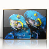 Framed wall art showcasing a vibrant design of colorful parrots in a lush tropical setting, featuring a sleek gold frame that enhances the artwork's elegance. This eye-catching piece is perfect for bird lovers and adds a lively touch to any decor.