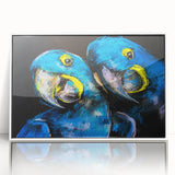 Framed wall art featuring a vibrant parrot design in a modern acrylic frame, showcasing colorful birds against a white background, perfect for home decor.