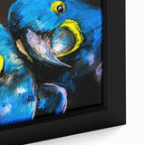 Close-up of a framed canvas wall art depicting colorful parrots perched on branches, showcasing vibrant greens and yellows, perfect for nature-themed decor.
