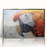 Framed wall art showcasing a vibrant parrot design with a silver-acrylic finish, perfect for adding a colorful, tropical touch to home decor.