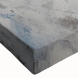 Close-up view of a vibrant stretched canvas wall art featuring a colorful assortment of tropical parrots perched amidst lush green foliage, ideal for adding a lively touch to home decor.