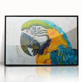 Framed acrylic wall art featuring a vibrant design of colorful parrots, showcasing intricate details and a sleek black frame, perfect for home decor.
