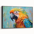 Framed canvas wall art showcasing a vibrant parrot design with rich colors, displayed from a black side view, ideal for tropical decor enthusiasts.