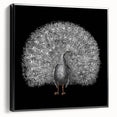 Framed wall art featuring an elegant peacock design on canvas, showcasing vibrant colors and intricate details, displayed in a sleek black frame for a modern aesthetic.