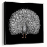 Framed wall art featuring an elegant peacock design on canvas, showcasing vibrant colors and intricate details, displayed in a sleek black frame for a modern aesthetic.