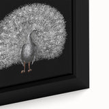 Close-up of a framed canvas wall art piece featuring a vibrant peacock design with intricate details and rich colors, perfect for adding elegance to home decor.