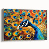 Framed canvas wall art featuring a vibrant peacock design in rich colors, set against a silver frame, showcasing elegant artistry ideal for home decor.