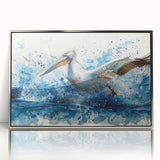 Framed acrylic wall art featuring a detailed pelican design in silver tones, showcasing intricate textures and reflections, perfect for elegant home decor.