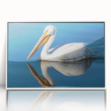 Framed wall art featuring a pelican design in vibrant colors, set in a sleek white frame, perfect for coastal-themed decor or nature enthusiasts.