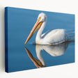 Stretched canvas wall art featuring a side view of a colorful pelican design, perfect for enhancing coastal-themed home decor with vibrant hues and intricate details.