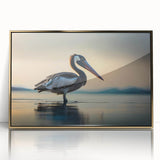 Framed wall art featuring a sleek, modern design of a pelican in gold tones, displayed with a clear acrylic front, perfect for enhancing contemporary home decor.
