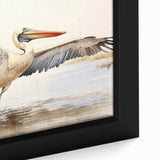 Close-up of a framed canvas wall art featuring a colorful pelican design, showcasing vibrant blues, yellows, and greens, perfect for coastal home decor.