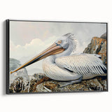 Framed canvas wall art featuring a serene pelican design in a modern black frame, showcasing intricate details and a side view perspective, perfect for coastal decor.
