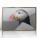 Framed wall art collection featuring a vibrant puffin design with gold accents, displayed in an acrylic frame, perfect for enhancing coastal-themed decor.