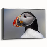 Framed canvas wall art featuring a colorful puffin design, displayed from the side against a neutral background, showcasing vibrant colors and intricate details. Perfect for bird lovers and home decor enthusiasts.