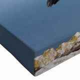 Close-up of a vibrant puffin wall art design printed on stretched canvas, showcasing intricate details and bold colors, ideal for enhancing home decor.