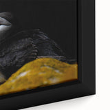 Framed canvas wall art featuring a vibrant, close-up design of a puffin, showcasing intricate details and a colorful background, perfect for bird lovers and home decor enthusiasts.