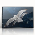 Framed wall art featuring a collection of sea birds in a minimalist design, showcased in a sleek black frame, ideal for coastal-themed decor.