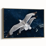 Framed canvas wall art showcasing a vibrant sea birds design with gold accents, elegantly displayed in a contemporary setting, perfect for coastal decor.