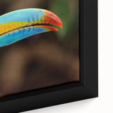 Close-up of a vibrant tropical bird wall art design featuring colorful parrots and exotic foliage, framed on canvas, ideal for enhancing home decor.