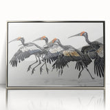 Framed wall art featuring a vibrant tropical birds design, showcasing colorful plumage and intricate details, set in a sleek silver frame, ideal for home decor.