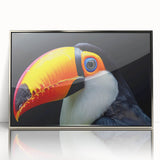 Framed wall art featuring vibrant tropical birds in a lush jungle setting, presented in a sleek silver frame, perfect for enhancing home décor with a splash of color and nature.
