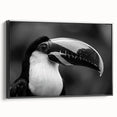 Framed canvas wall art featuring a vibrant tropical birds design with shades of green, yellow, and blue, displayed from a black side view, perfect for adding a lively touch to home decor.