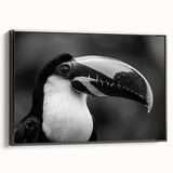 Framed canvas wall art featuring a vibrant tropical birds design with shades of green, yellow, and blue, displayed from a black side view, perfect for adding a lively touch to home decor.