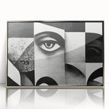 Framed black and white abstract wall art design featuring dynamic shapes and lines, set against a sleek silver frame, ideal for modern décor.