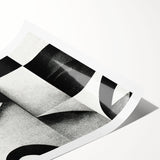 Stylish black and white abstract design rolled wall art print, featuring dynamic shapes and textures, ideal for modern home decor.