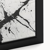 Close-up of a framed black and white abstract wall art design showcasing fluid shapes and lines, perfect for modern home decor accents.