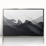 Framed black and white abstract wall art design featuring dynamic shapes and textures, set in a sleek silver frame, ideal for modern decor.
