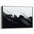 Framed black and white abstract wall art featuring a modern design, displayed in a sleek black frame, showcasing elegant lines and textures.