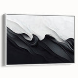 Framed black and white abstract wall art showcasing dynamic geometric shapes and lines, set against a sleek white backdrop for modern decor.