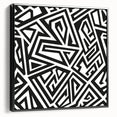Framed black and white abstract wall art design showcasing dynamic shapes and patterns, set against a sleek black frame side view.