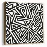 Framed black and white abstract wall art with a gold border, showcasing a modern design suitable for contemporary home decor.