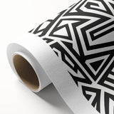 Black and white abstract design on rolled canvas, showcasing fluid shapes and lines, ideal for modern home decor or gallery walls.