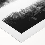 Rolled canvas showcasing a black and white abstract design, featuring dynamic shapes and textures, ideal for modern interior decor.