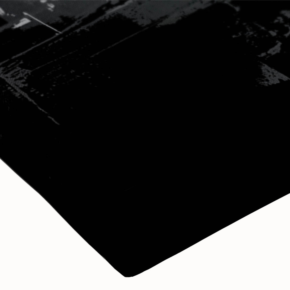 Close-up of a black and white abstract design stretched canvas wall art, showcasing bold geometric shapes and intricate textures for modern decor.